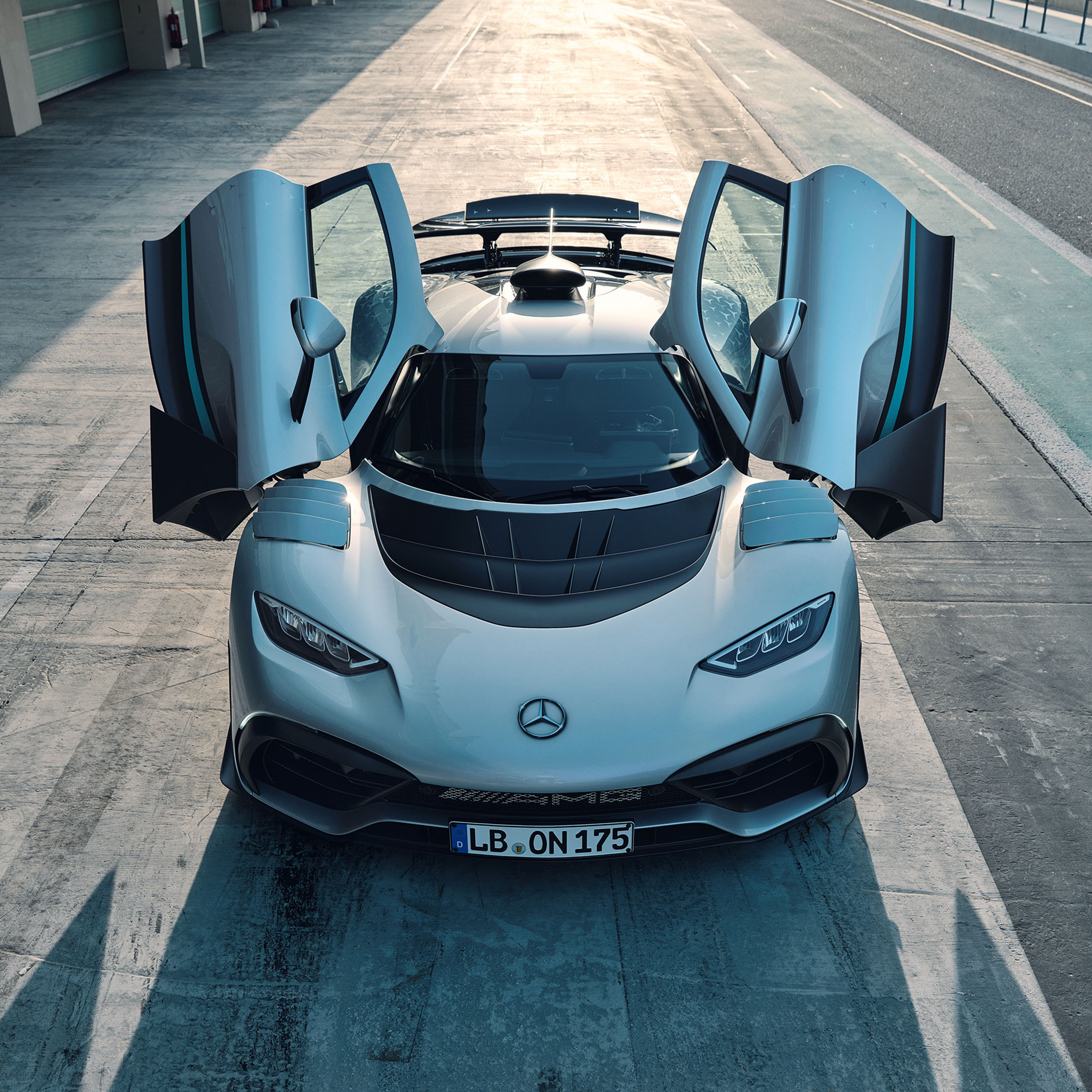 Exterior | Mercedes-AMG | E-PERFORMANCE Front view of the Mercedes-AMG ONE with the doors open.