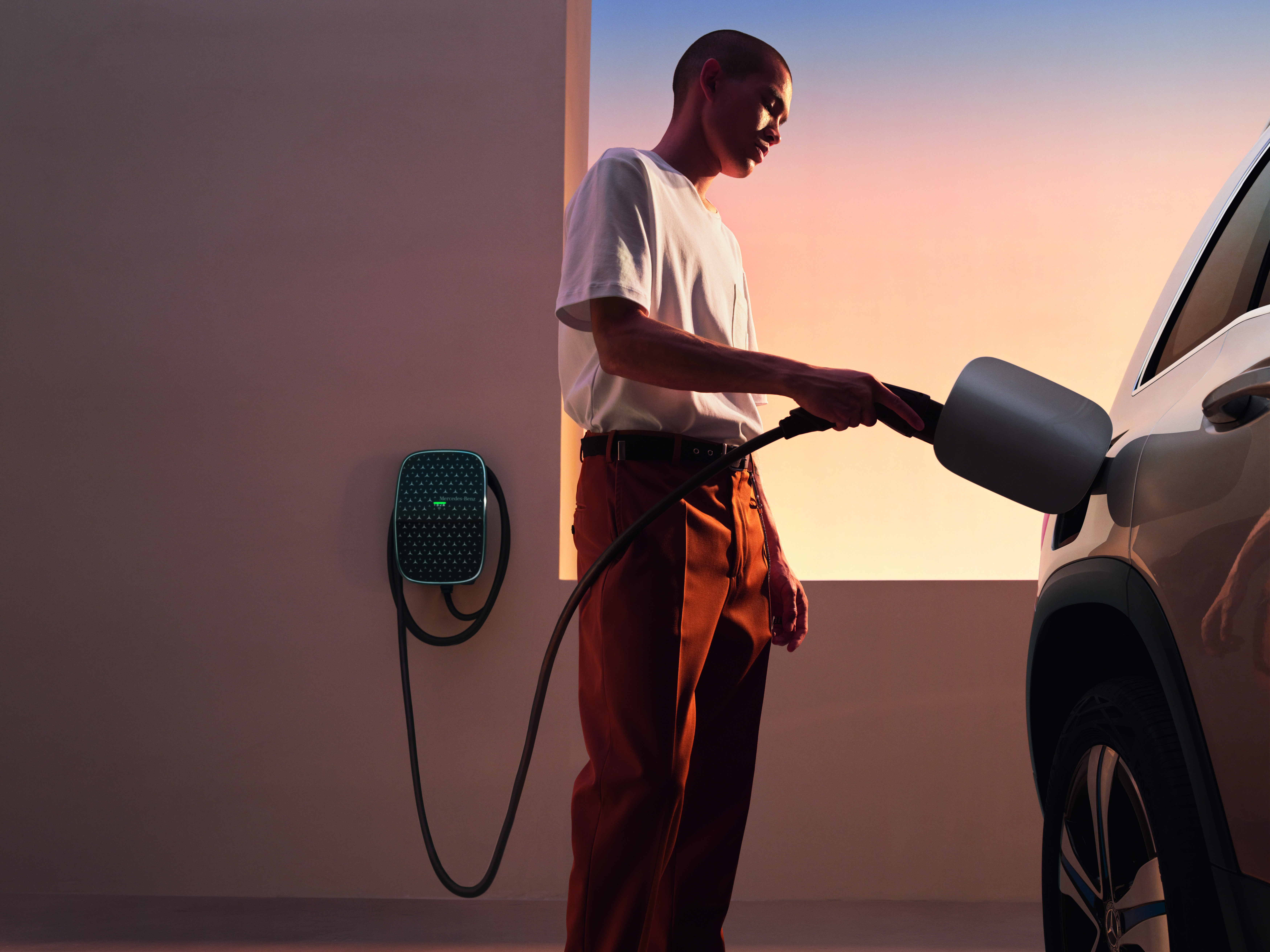 There are so many charging options to choose from with Mercedes-Benz A man charging a Mercedes-EQ or Mercedes-Benz plug-in hybrid