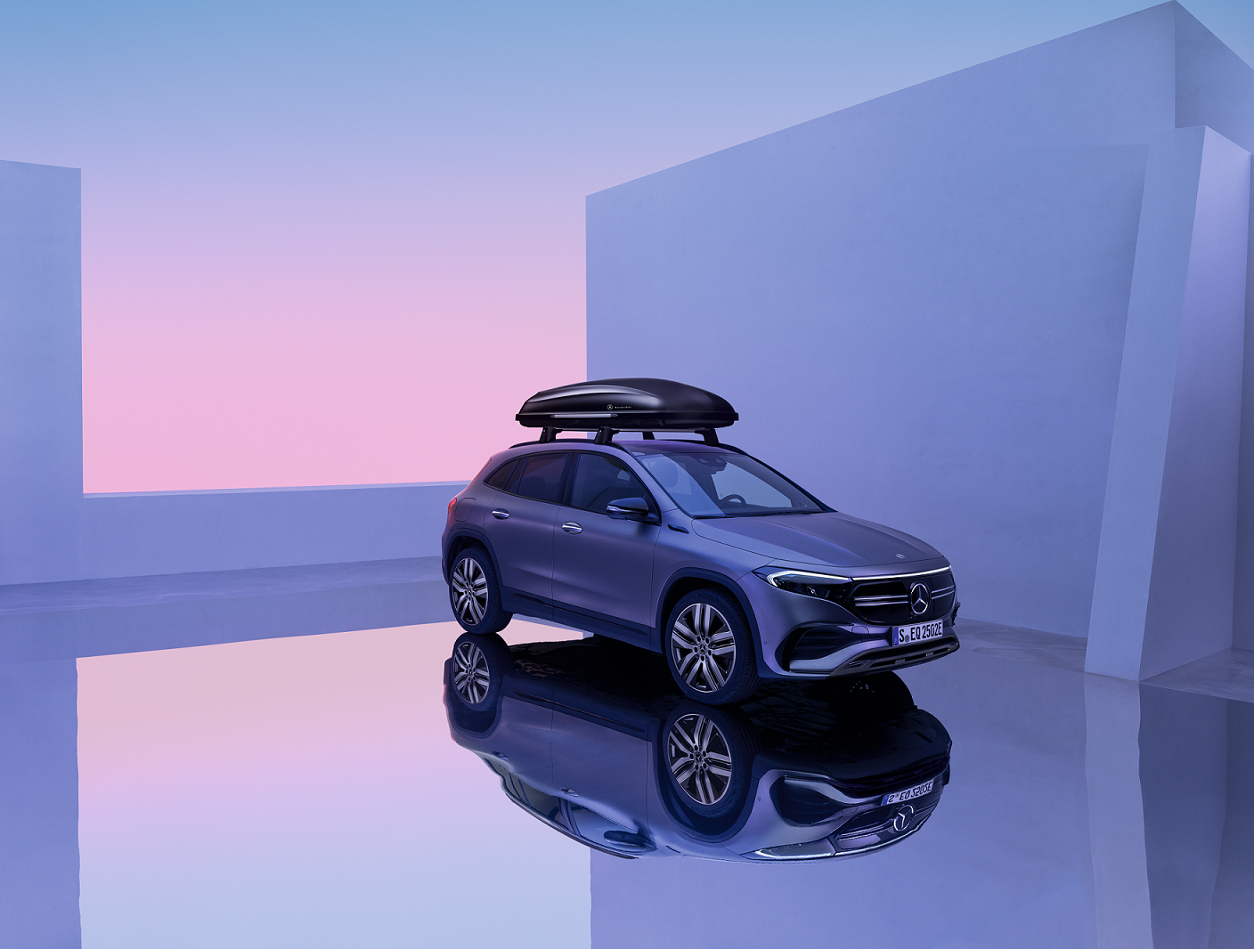 EQA | Mercedes-Benz The Mercedes-Benz EQA is in a showroom with a roof luggage rack.