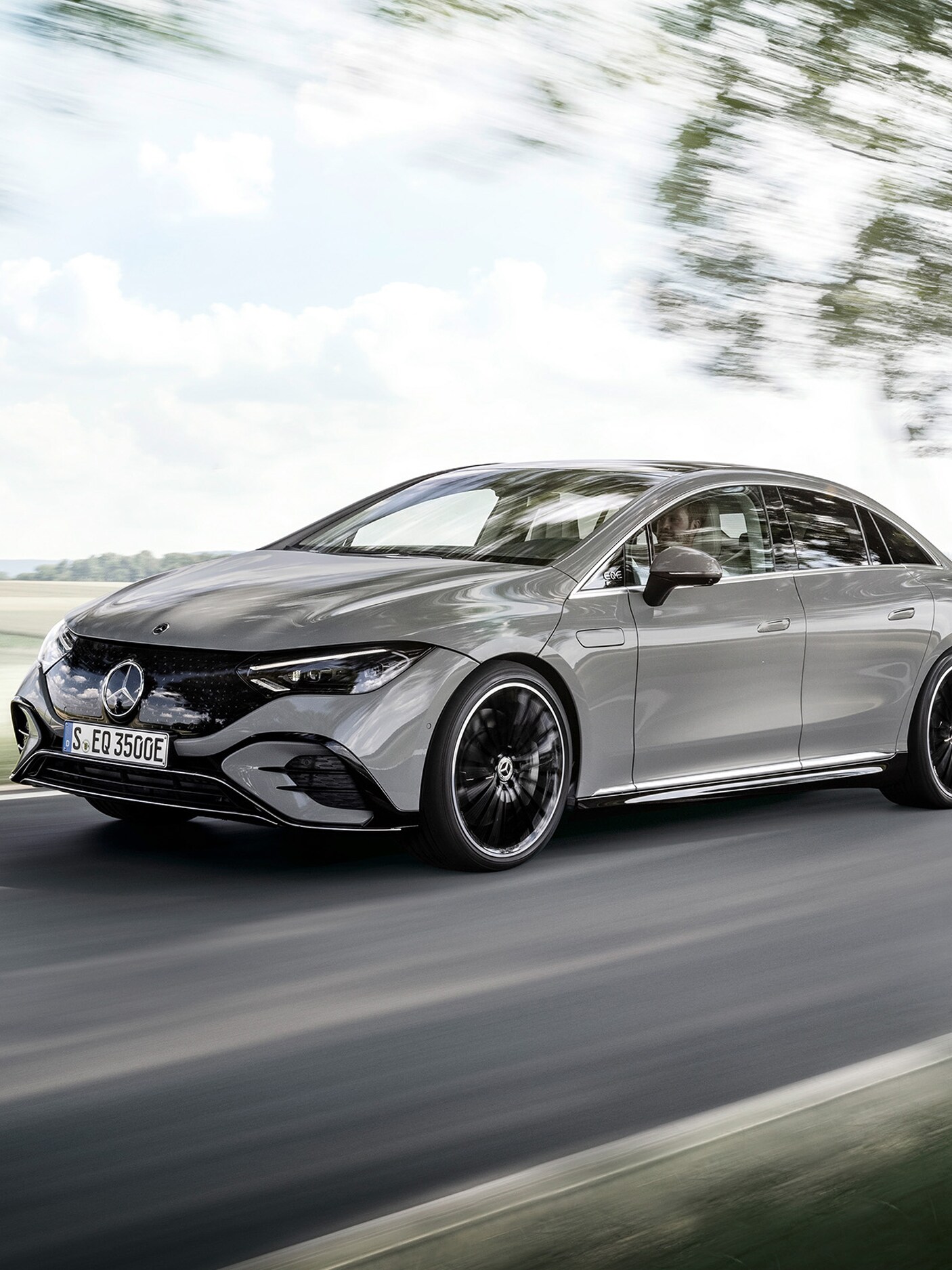 Angled front view of an EQS on a country road