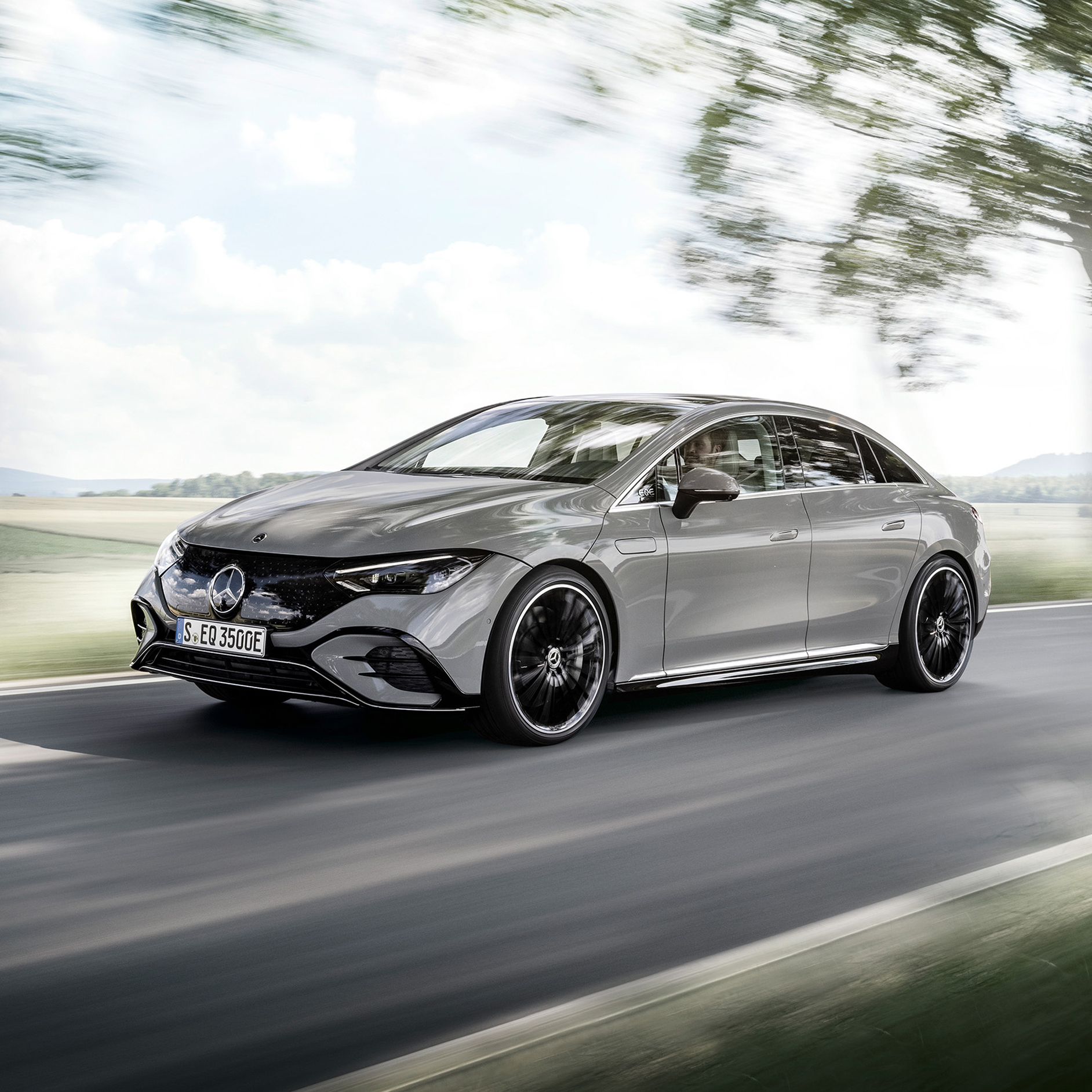 On the road to a more sustainable future | On land, on water and in the air | Mercedes-Benz Angled front view of an EQS on a country road