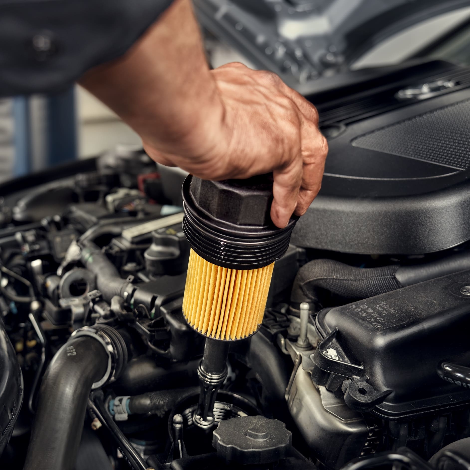 Keeps the oil in your Mercedes-Benz clean | Genuine Parts | Mercedes-Benz A Mercedes-Benz technician changes the oil filter in the vehicle.
